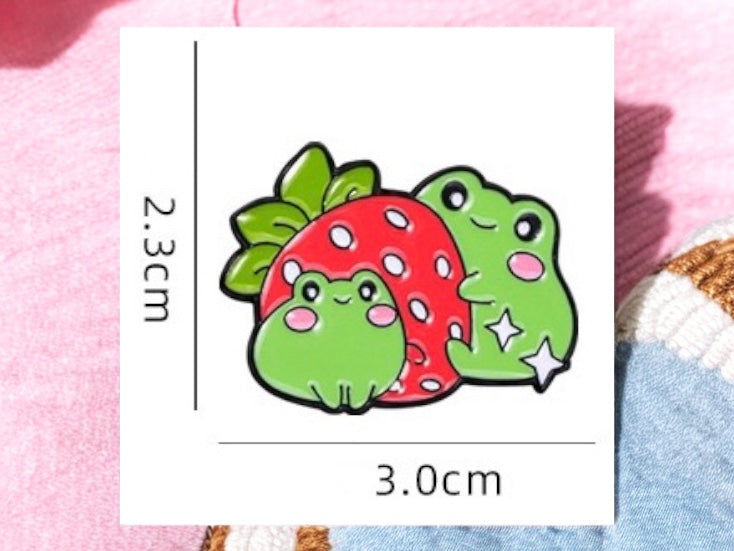 Pin's Broche Email | Grenouille Fraise ou Livre | Amoureux des Grenouilles | Kawaii | Fun | Mignon Dessin Animé